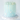Cake covered in light blue/turquoise buttercream with white to light blue rosettes on top, white buttercream icing dripping down the sides and candy/sugar snowflake accents of varying sizes all over the mid-base of the cake. Some frost sugar effect at the complete base with little edible tiny marbles at the base. Sitting on a cake board on top of a white ceramic wavy cake stand.